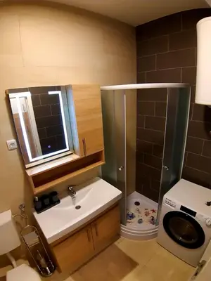 a bathroom with a shower and a sink and a toilet at Apartment Jelena in Banja Luka