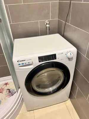 a washer and dryer in a small bathroom at Apartment Jelena in Banja Luka