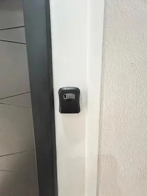 a clock on the side of a white door at Apartment Jelena in Banja Luka