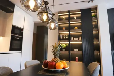 a bowl of fruit on a table in a kitchen at ModernApartmentsBL in Banja Luka