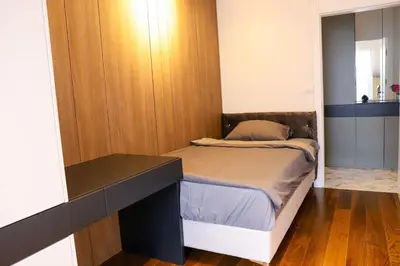 a small bedroom with a bed and a desk at ModernApartmentsBL in Banja Luka