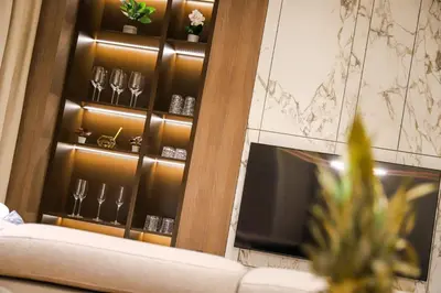 a room with a wine rack with glasses on it at ModernApartmentsBL in Banja Luka