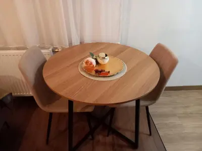 a table with a plate of food and a cup of coffee at Apartman Mijate in Banja Luka