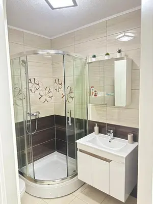 a bathroom with a shower and a sink at Apartman SLEEP&JOY Tuzla in Tuzla