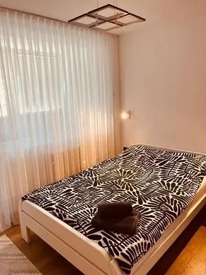 a bedroom with a zebra print bed in a room at Apartman Alan in Travnik