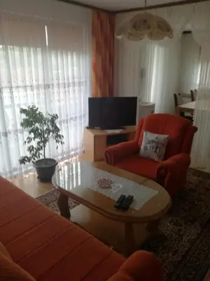 a living room with a couch and a coffee table at Apartman Halida in Visoko