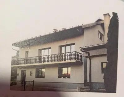 a large house with a balcony on top of it at Apartman Halida in Visoko