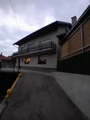 an empty parking lot in front of a house at Apartman Halida in Visoko
