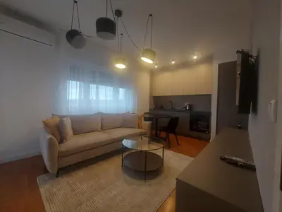 a living room with a couch and a table at BL Lux in Banja Luka