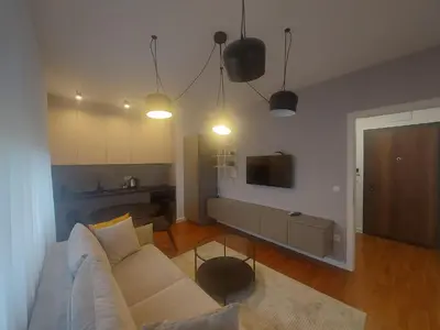 a living room with a couch and a tv at BL Lux in Banja Luka