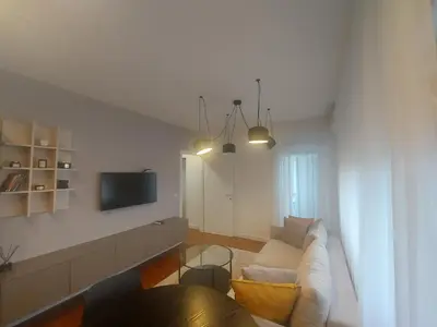 a living room with a couch and a tv at BL Lux in Banja Luka
