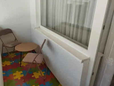 a room with two chairs and a window at Apartman Miloš in Bosanska Dubica