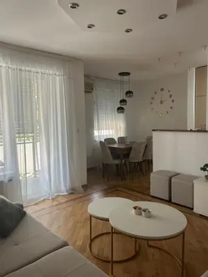 a living room with a couch and a table at Vert Lux in Banja Luka