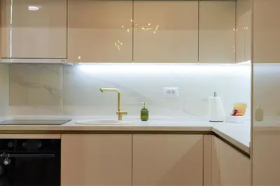 a kitchen with a sink and a counter top at Palata Gold Apartment in Banja Luka