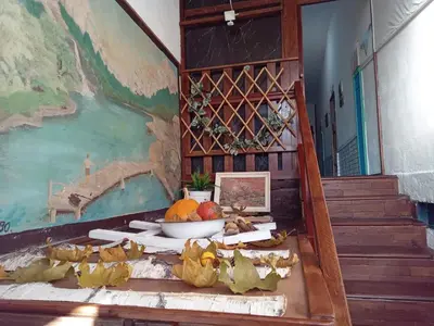 a room with a table with a bowl of fruit on it at Apartman Retro in Žepče