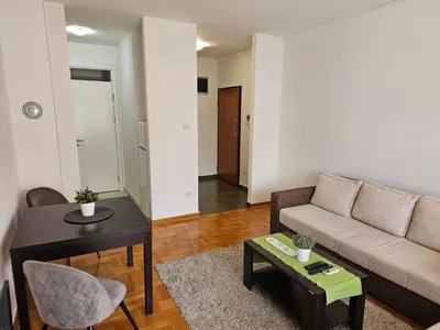 a living room with a couch and a table at Stan Svetozara Markovića 5A in Banja Luka