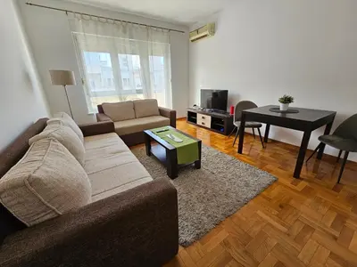 a living room with a couch and a table at Stan Svetozara Markovića 5A in Banja Luka