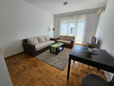 a living room with a couch and a table at Stan Svetozara Markovića 5A in Banja Luka