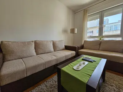 a living room with a couch and a table at Stan Svetozara Markovića 5A in Banja Luka