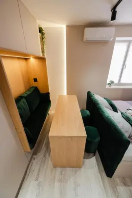 a living room with a couch and a table at Studio Compact in Doboj