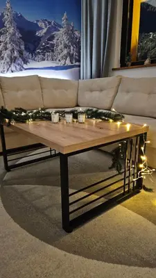 a coffee table in a living room with a couch at Friends Vlašić in Vlasic