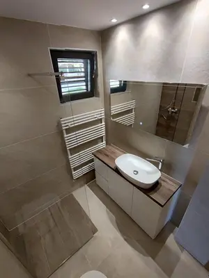 a bathroom with a sink and a mirror at Friends Vlašić in Vlasic