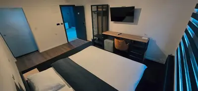 an overhead view of a room with a bed and a desk at IB Oil doo Restoran s prenoćištem in Cazin
