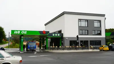 a gas station on a street with a car parked in front at IB Oil doo Restoran s prenoćištem in Cazin
