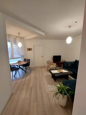 a living room with a couch and a table at Vista Bihać in Bihać