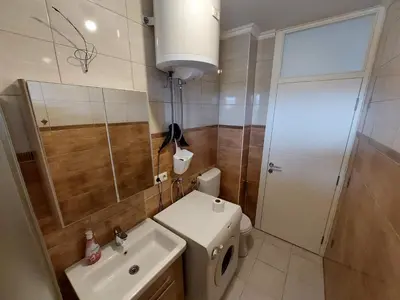 a bathroom with a toilet and a sink and a shower at Vista Bihać in Bihać