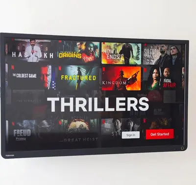 a television screen with many movies on it at City Central Apartment - Top location in Banja Luka