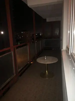a table in a room with a view of the city at Apartman Mokusnice Zenica in Zenica