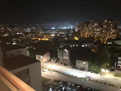 a view of a city at night with lights at Apartman Mokusnice Zenica in Zenica