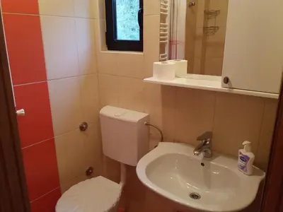 a small bathroom with a toilet and a sink at Guest House Majstorovic in Banja Luka