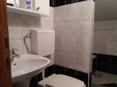 a bathroom with a toilet and a sink at Guest House Majstorovic in Banja Luka