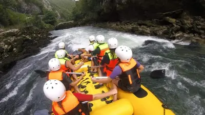a group of people in a raft on a river at Guest House Majstorovic in Banja Luka