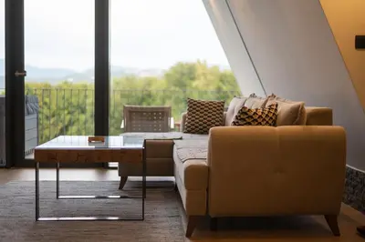 a living room with a couch and a table at Vila Hill Rest in Visoko