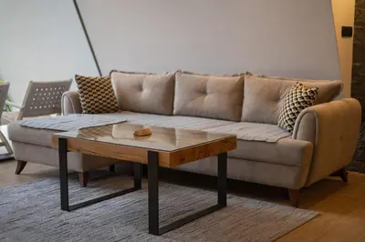 a living room with a couch and a coffee table at Vila Hill Rest in Visoko