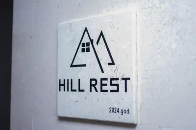 a switch on a wall with a hill rest sign at Vila Hill Rest in Visoko