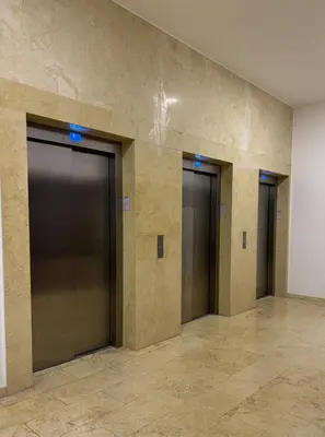 a row of elevator doors in a building at Apartman Blanka in Banja Luka