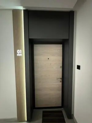 a hallway with a door in a building at Apartman Blanka in Banja Luka