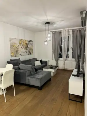 a living room with a couch and a table at Apartman Blanka in Banja Luka