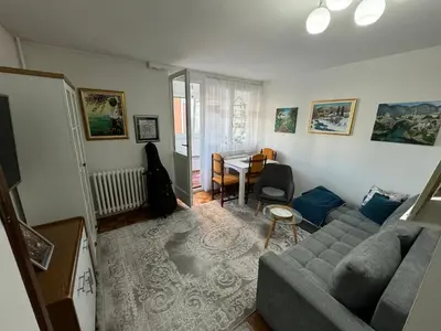 a living room with a couch and a table at Stan na dan in Zenica