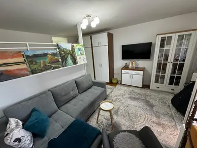 a living room with a couch and a flat screen tv at Stan na dan in Zenica