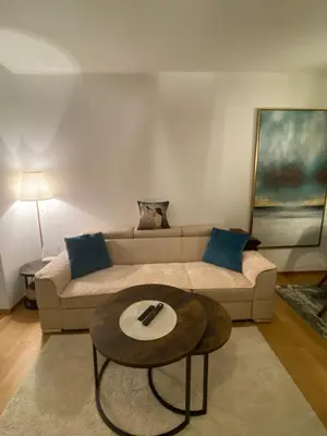 a living room with a couch and a table at RED home in Banja Luka