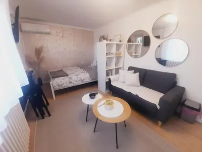 a living room with a couch and a table at Studio Apartman in Banja Luka