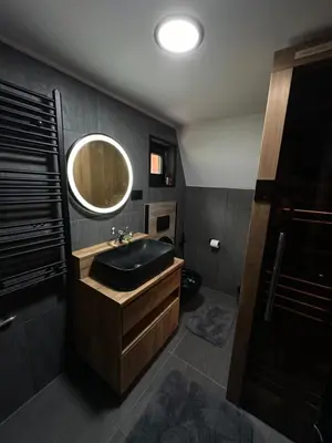 a bathroom with a sink and a mirror at Plivska vila 1 in Jajce