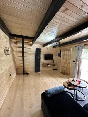 a living room with a couch and a table at Plivska vila 1 in Jajce