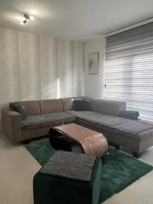 a living room with a couch and a table at Premium in Prijedor