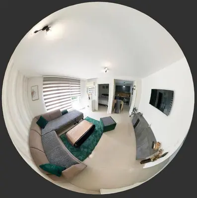 a large living room with a couch and a tv at Premium in Prijedor